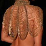 Gold beaded shoulder piece on a black background